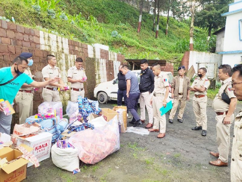Officials with the seized banned tobacco products. (Photo Courtesy: State Tobacco Control Cell)