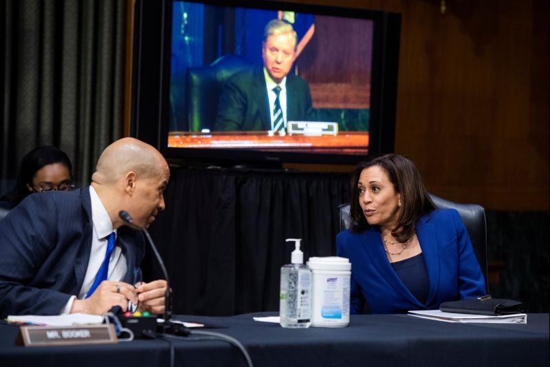 Senators Cory Booker (D-NJ) and Kamala Harris (D-CA) attend the Senate Judiciary Committee hearing titled "Police Use of Force and Community Relations," in the Dirksen Senate Office Building in Washington, DC on June 16, 2020. Chairman Lindsey Graham (R-SC) appears on the monitor. (REUTERS Photo)
