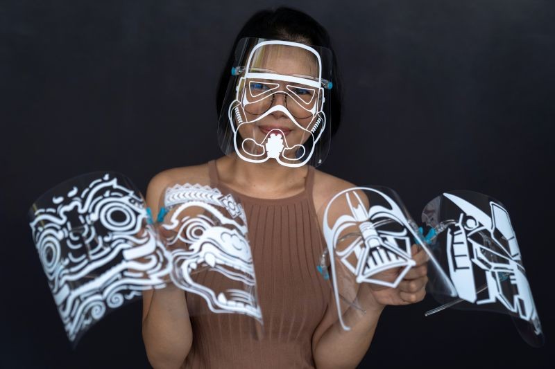 Maysa Talerd, 31, an entrepreneur wears her own design of the Stormtrooper face shield as she poses with other designs, during an interview with Reuters amid the spread of the coronavirus (COVID-19) disease in Bangkok, Thailand on June 11, 2020. (REUTERS Photo)