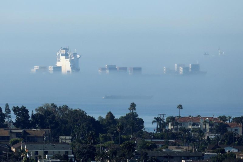 A cargo ship sits in the fog off the shore of the Long Beach port during the outbreak of the coronavirus disease (COVID-19) in Long Beach, California, US on April 23, 2020. (REUTERS File Photo)