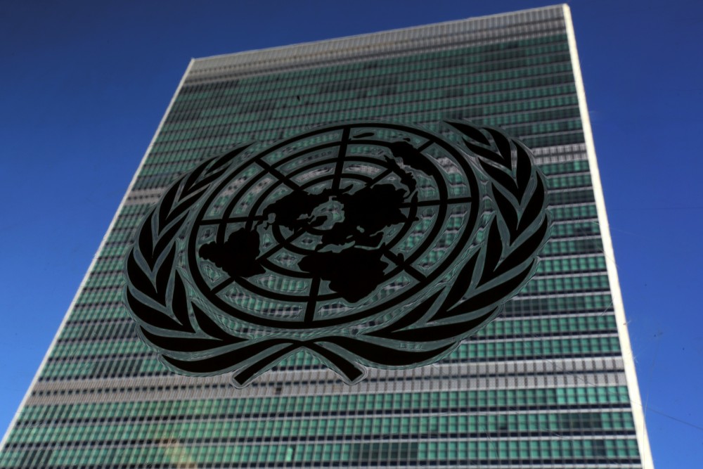 FILE PHOTO: The United Nations logo is pictured in front of the United Nations Headquarters building during the 71st United Nations General Assembly in the Manhattan borough of New York, U.S., September 22, 2016. (REUTERS/Carlo Allegri)