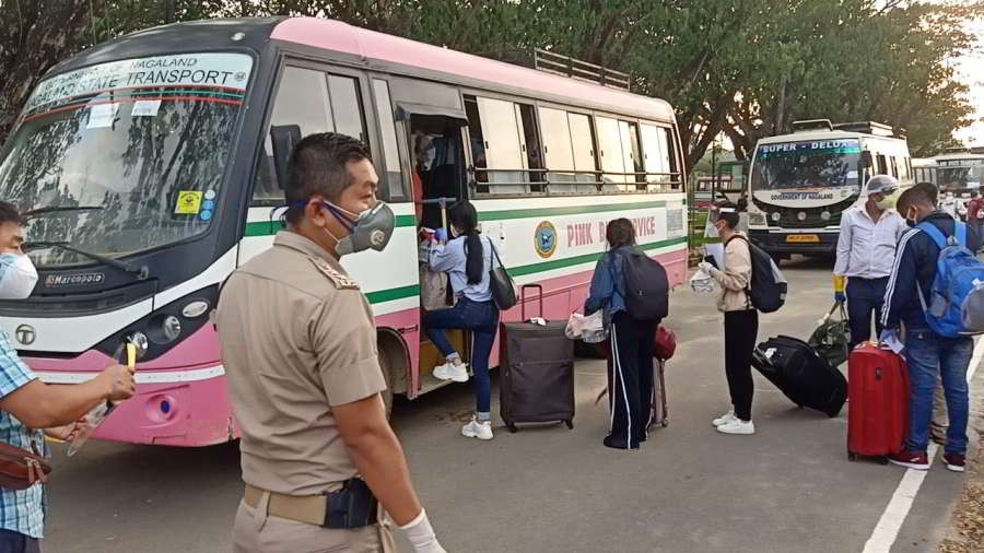 Returnees boarding a Nagaland State Transport bus at Dimapur Airport on June 3. (Morung Photo)