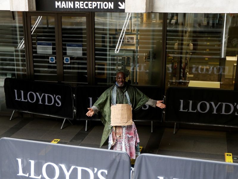 Demonstrator Clapper Priest walks towards the reception of the Lloyd's building in the City of London financial district, in London, Britain on June 18, 2020. (REUTERS Photo)
