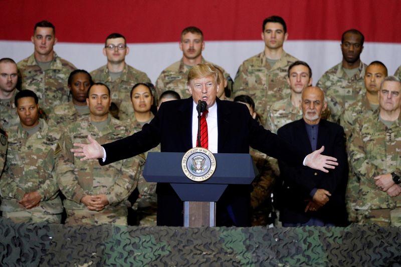 U.S. President Donald Trump delivers remarks to U.S. troops, with Afghanistan President Ashraf Ghani standing behind him, during an unannounced visit to Bagram Air Base, Afghanistan on November 28, 2019. (REUTERS File Photo)