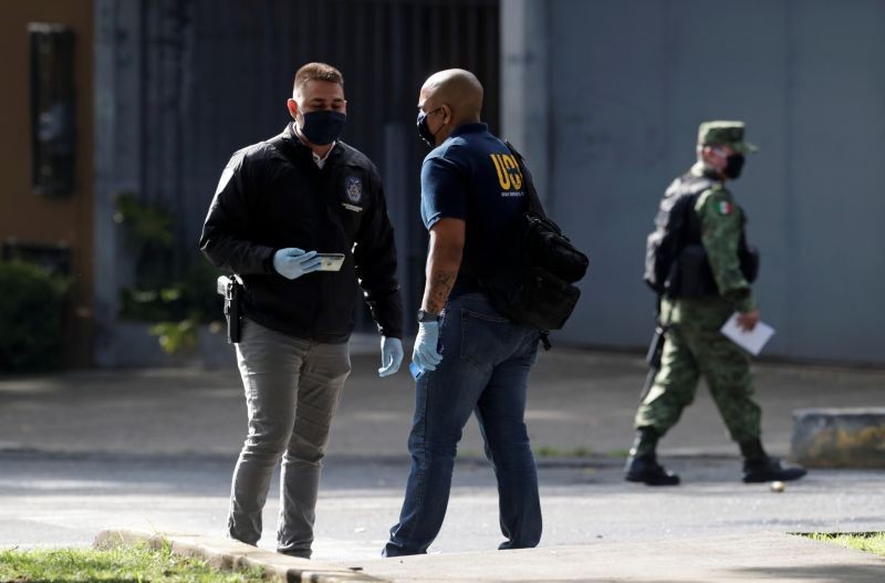Investigative police officers check the area near the scene of a shooting in Mexico City, Mexico on June 26, 2020. (REUTERS Photo)