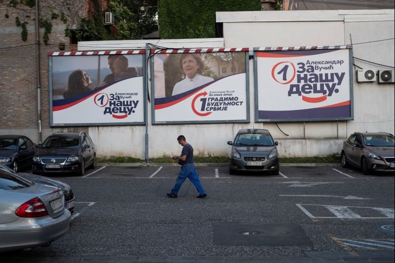 A man walks past election campaign posters of ruling Serbian Progressive Party in Belgrade, Serbia on June 18, 2020. (REUTERS File Photo)