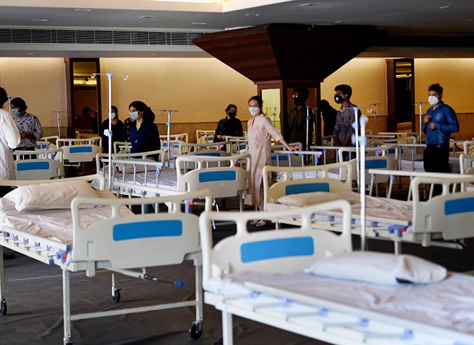 New beds set put inside the Shehnai Banquet Hall opposite LNJP Hospital, temporarily converted into isolation wards for COVID-19 patients, at JL Nehru Marg in New Delhi. Photograph: Kamal Singh/PTI Photo