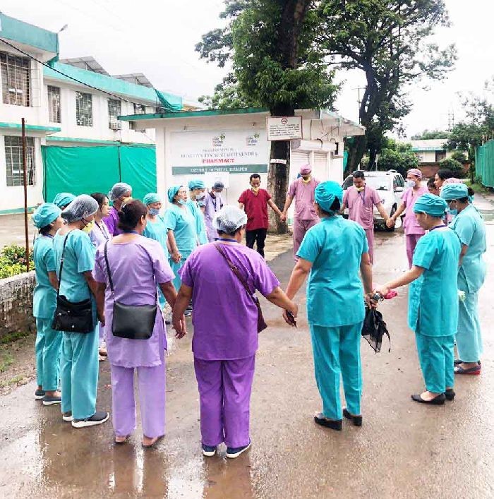 A team of health workers on COVID-19 duty prays in the hospital premises somewhere in Nagaland. The Nagaland Health and Family Welfare, Minister, S Pangnyu Phom today paid “grand salute” to all the frontline workers. “In this unprecedented time, I am overwhelmed to see our fearless warriors shielding our lives for 24x7. Your act of sacrificial and commitment to deliver the unceasing health care services is extraordinary and commendable. Profoundly conveying you all a grand Salute,” the Minister posted on his twitter handle on June 18. (Photo Courtesy: spangnyuphom@twitter)