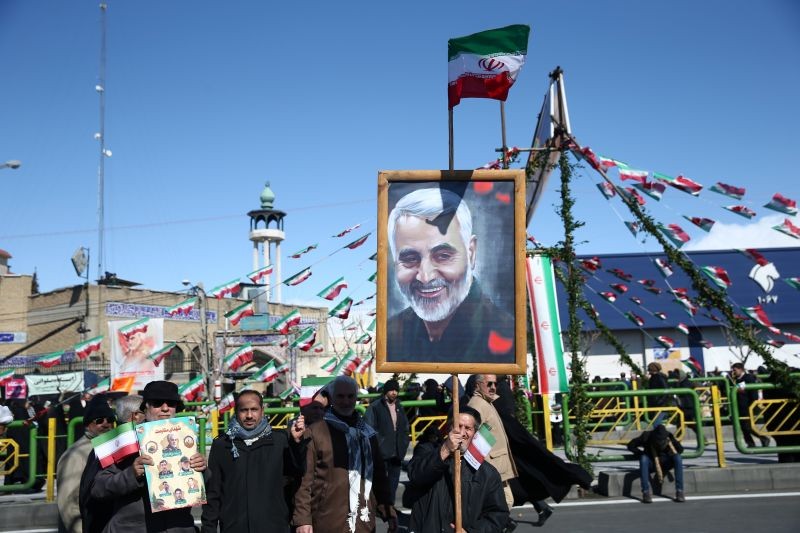 An Iranian man holds a picture of the late Iran's Quds Force top commander Qassem Soleimani, during the commemoration of the 41st anniversary of the Islamic revolution in Tehran, Iran on February 11, 2020. (REUTERS File Photo)