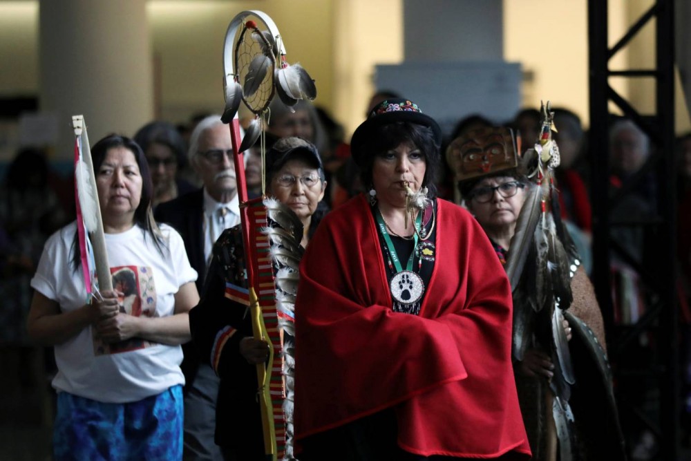 Women march in during the closing ceremony of the National Inquiry into Missing and Murdered Indigenous Women and Girls in Gatineau, Quebec, Canada, June 3, 2019. REUTERS/Chris Wattie