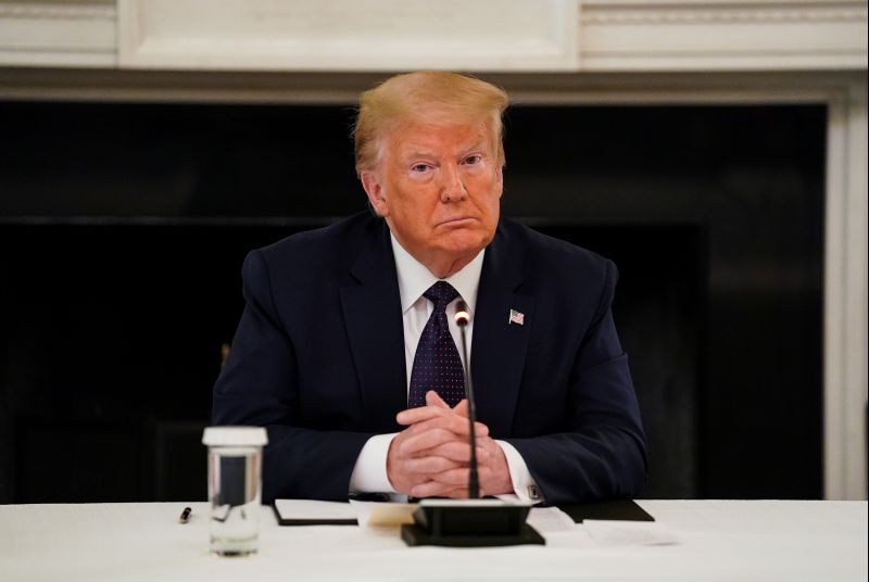 U.S. President Donald Trump listens during a roundtable discussion with law enforcement in the State Dining Room at the White House in Washington, US on June 8, 2020. (REUTERS Photo)