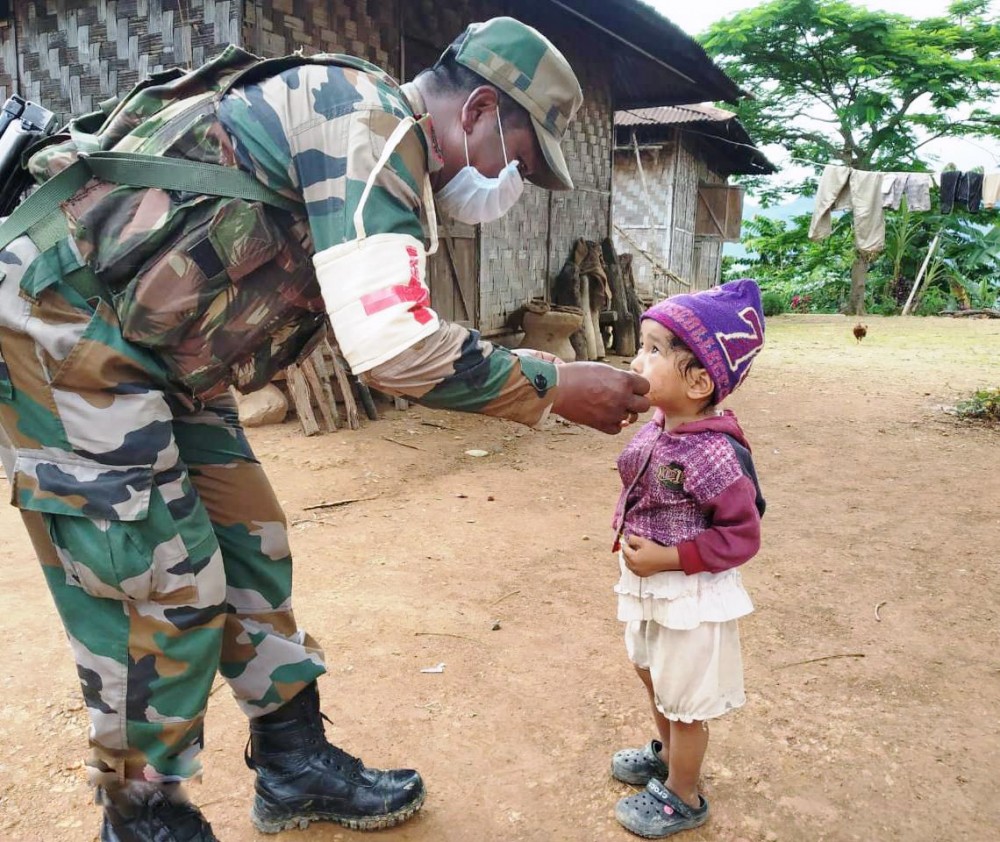 AR personnel interact with a child somewhere in Nagaland. (Photo Courtesy: HQ IGAR North)