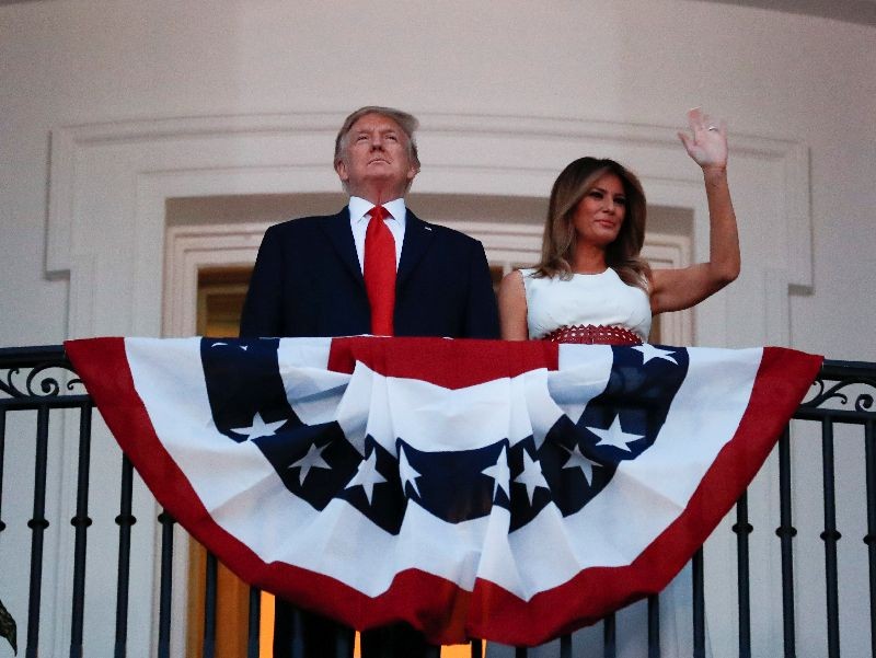 U.S. President Donald Trump and first lady Melania Trump watch the Washington, D.C. fireworks display from the Truman Balcony as they celebrate the U.S. Independence Day holiday at the White House in Washington, U.S., July 4, 2020.   REUTERS/Carlos Barria