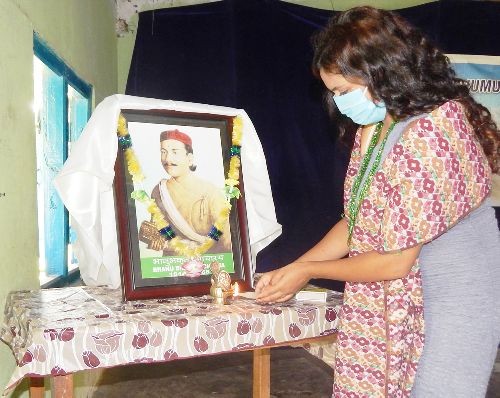 A member of the Chümoukedima Gorkha Youth lights up a lamp during the celebration of Bhanu Jayanti at Chümoukedima Town on July 13. (Photo Courtesy: CGY)