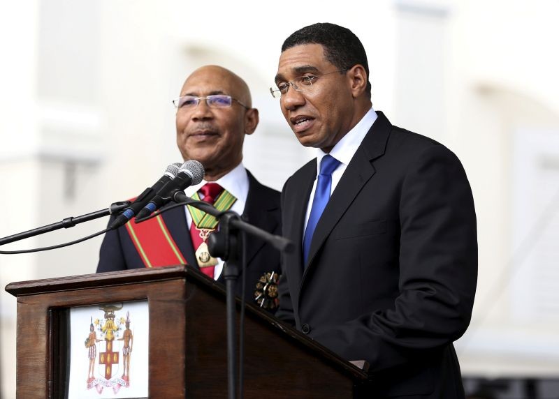 Jamaica's Prime Minister Andrew Holness (R) addresses the audience next to Jamaica's Governor-General Sir Patrick Allen during his swearing-in ceremony in Kingston on March 3, 2016. (REUTERS File Photo)