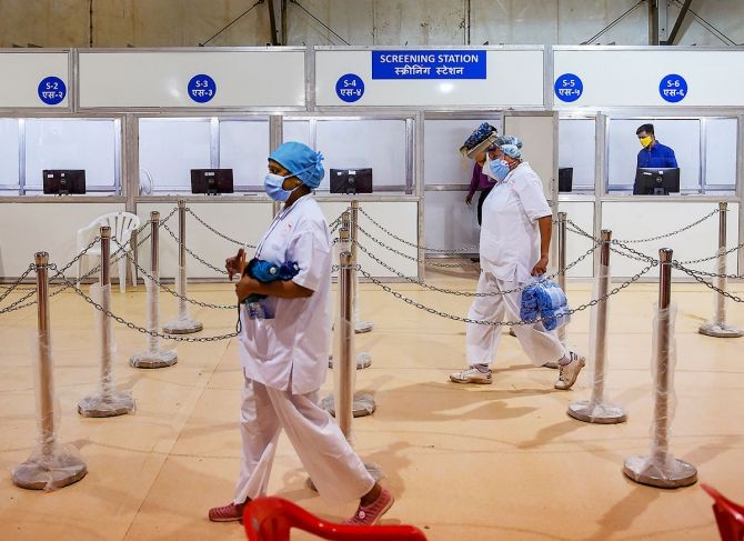 Nurses from Tata Memorial Hospital walk inside a temporary facility created to aid cancer patients diagnosed with COVID-19, in Mumbai, on Thursday. Photograph: Kunal Patil/PTI Photo