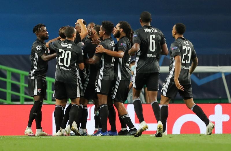 Soccer Football - Champions League Quarter Final - Manchester City v Olympique Lyonnais - Jose Alvalade Stadium, Lisbon, Portugal - August 15, 2020  Olympique Lyonnais' Moussa Dembele celebrates scoring their second goal with teammates, as play resumes behind closed doors following the outbreak of the coronavirus disease (COVID-19)  Miguel A. Lopes/Pool via REUTERS