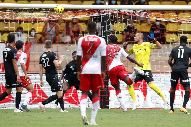 Soccer Football - Ligue 1 - AS Monaco v Stade de Reims - Stade Louis II, Monaco - August 23, 2020 AS Monaco's Axel Disasi scores their first goal, as play resumes following the outbreak of the coronavirus disease (COVID-19) REUTERS/Eric Gaillard