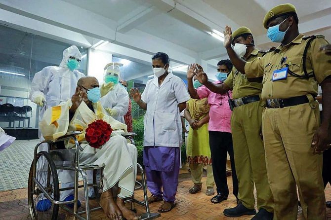 103-year-old Purakatt Veettil Pareed leaving the government hospital after getting COVID free in Kochi, August 19 2020. Photograph: Kbjaya Chandran/ANI Photo