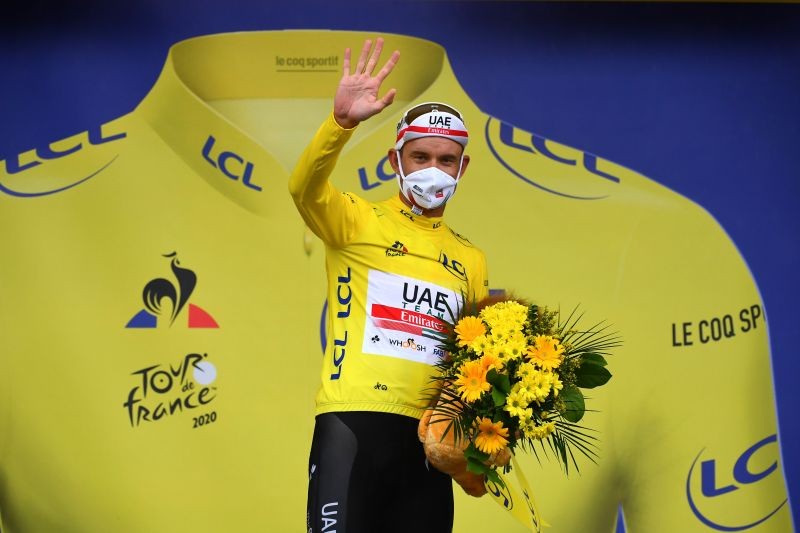 Cycling - Tour de France - Stage 1 - Nice Moyen Pays to Nice - France - August 29, 2020. UAE Team Emirates rider Alexander Kristoff of Norway, wearing the overall leader's yellow jersey, celebrates on the podium. Pool via REUTERS/Stuart Franklin