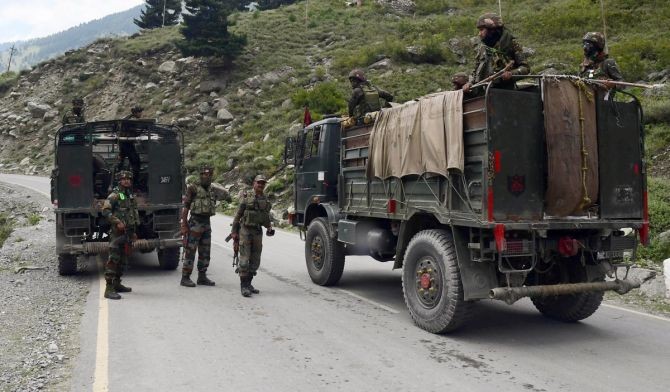 Army convoy moves on the Srinagar-Ladakh highway at Gagangeer, northeast part, in Srinagar. Photograph: ANI Photo
