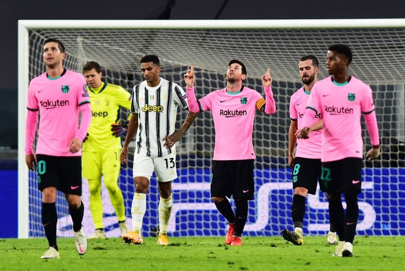 Soccer Football - Champions League - Group G - Juventus v FC Barcelona - Allianz Stadium, Turin, Italy - October 28, 2020  Barcelona's Lionel Messi celebrates scoring their second goal with teammates REUTERS/Massimo Pinca