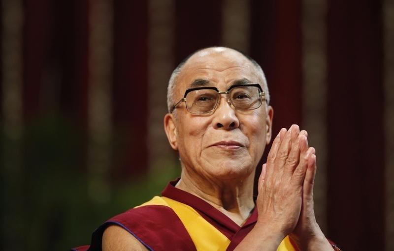 The Dalai Lama gestures before speaking to students during a talk at Mumbai University February 18, 2011. REUTERS/Danish Siddiqui