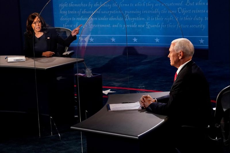 Democratic vice presidential nominee and U.S. Senator Kamala Harris answers a question as U.S. Vice President Mike Pence watches, during the 2020 vice presidential debate on the campus of the University of Utah in Salt Lake City, Utah, U.S., October 7, 2020. Â Morry Gash/Pool via REUTERS