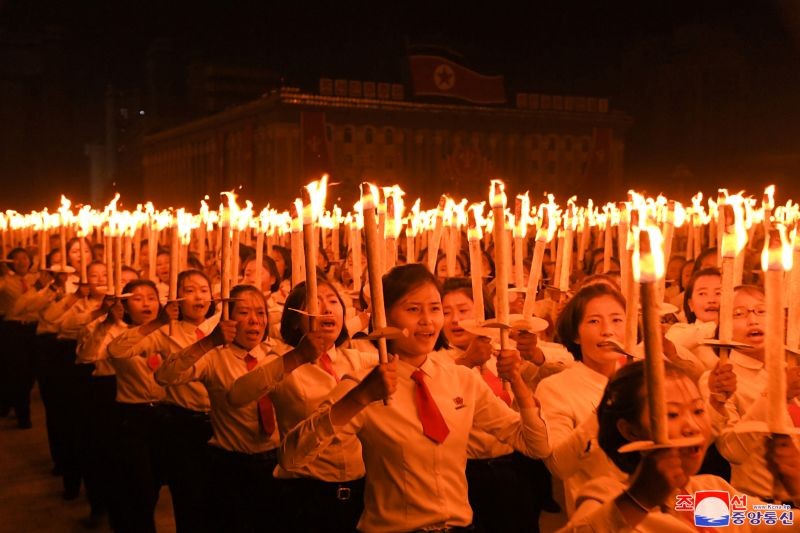 People take part in a procession to commemorate the 75th anniversary of the founding of the ruling Workers' Party of Korea (WPK), in Pyongyang, North Korea in this image released by North Korea's Central News Agency on October 10, 2020.    KCNA via REUTERS