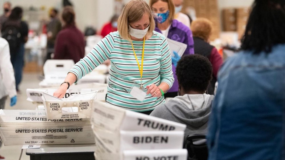 An election worker sorts through ballots during a Cobb County hand recount of Presidential votes. AP