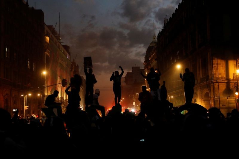Demonstrators take part in a protest to mark the International Day for the Elimination of Violence against Women, in Mexico City, Mexico, November 25, 2020. REUTERS/Carlos Jasso