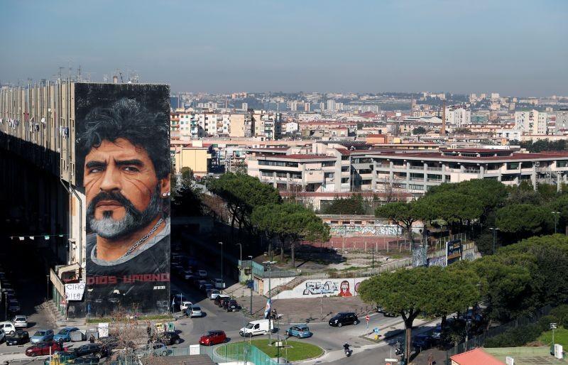 A general view shows a mural by artist Jorit depicting late Argentine soccer legend Diego Maradona, in Naples, Italy November 26, 2020. REUTERS/Yara Nardi
