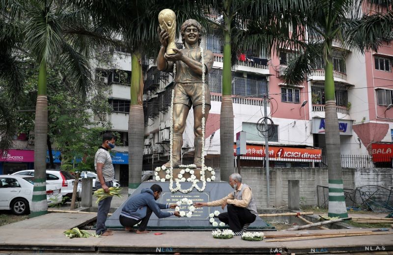 People decorate a statue of Argentine soccer great Diego Maradona before a prayer meeting, in Kolkata, India, November 26, 2020. REUTERS/Rupak De Chowdhuri