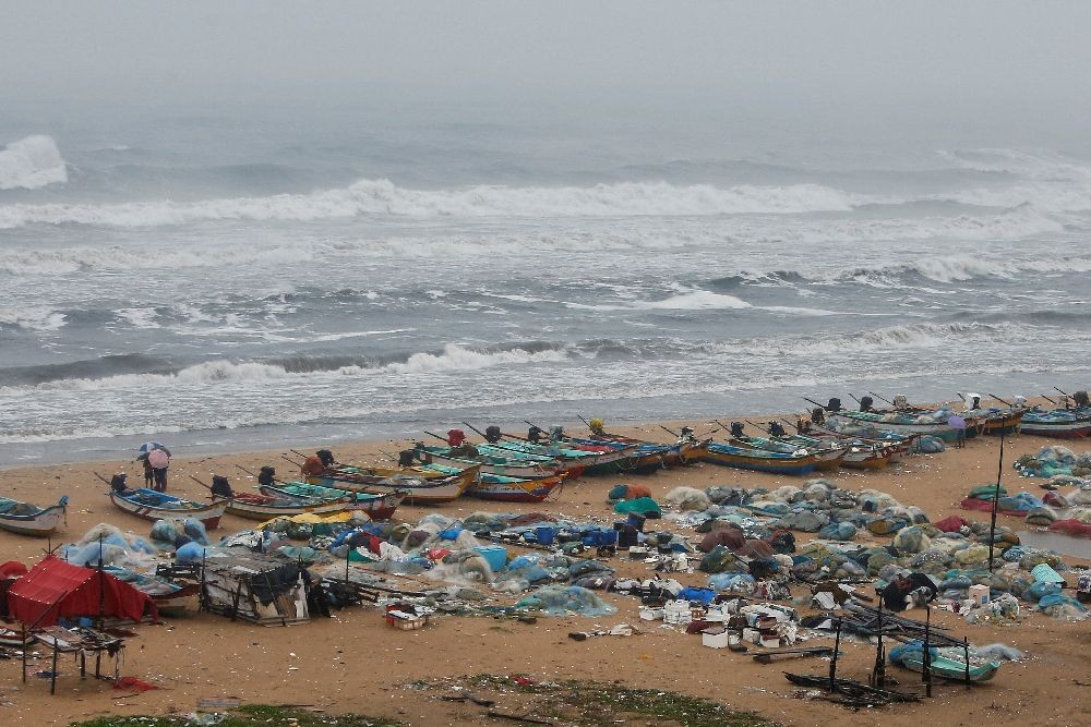 Boats are seen parked on deserted Marina beach during rains before Cyclone Nivar's landfall, in Chennai, India, November 25, 2020. REUTERS/P. Ravikumar