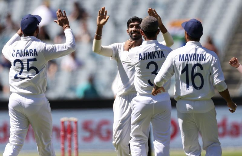 Melbourne : India's Jasprit Bumrah, centre, is congratulated by teammates after taking the wicket of Australia's Joe Burns for no score during play on day one of the Boxing Day cricket test between India and Australia at the Melbourne Cricket Ground, Melbourne, Australia, Saturday, Dec. 26, 2020.  AP/PTI(
