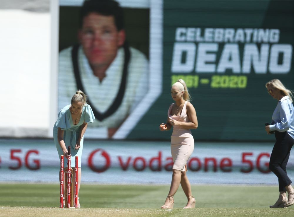 Melbourne : Daughters of former Australian cricketer Dean Jones, Phoebe, left, and Augusta walk with their mother, Jane, right, for a tribute for the late batsman who died in India, during the tea break on day one of the Boxing Day cricket test between India and Australia at the Melbourne Cricket Ground, Melbourne, Australia, Saturday, Dec. 26, 2020. AP/PTI