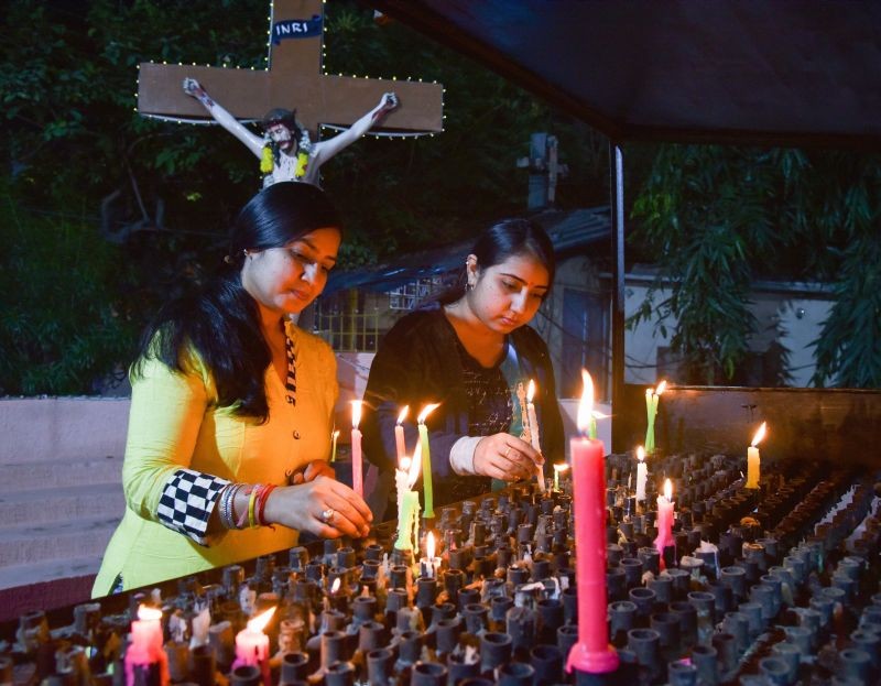 Hyderabad: Christian devotees light candles at a church on Christmas eve, in Hyderabad, Thursday night, Dec. 24, 2020. (PTI Photo)