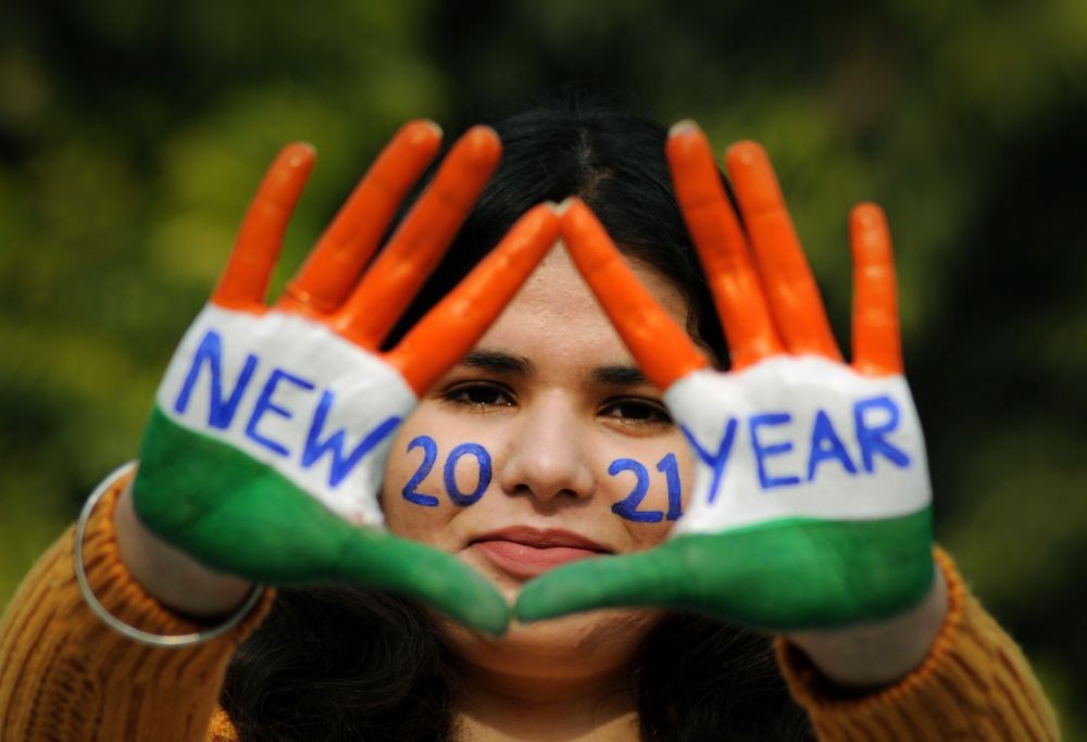 Amritsar: A young woman with painted hands poses for a photograph on the eve of New Year 2021, in Amritsar, Thursday, Dec. 31, 2020. (PTI Photo)