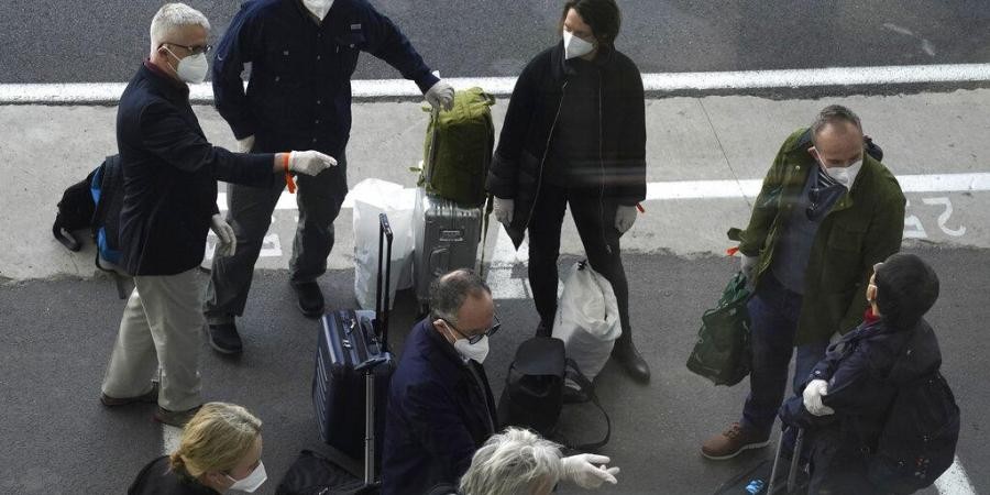 Members of a WHO team arrives in Wuhan in central China's Hubei province on Thursday, Jan. 14, 2021. (Photo | AP)