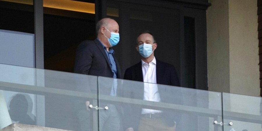 Members of the World Health Organization team chat on a hotel room balcony in Wuhan in central China's Hubei province on Friday, Jan. 29, 2021. (Photo | AP)