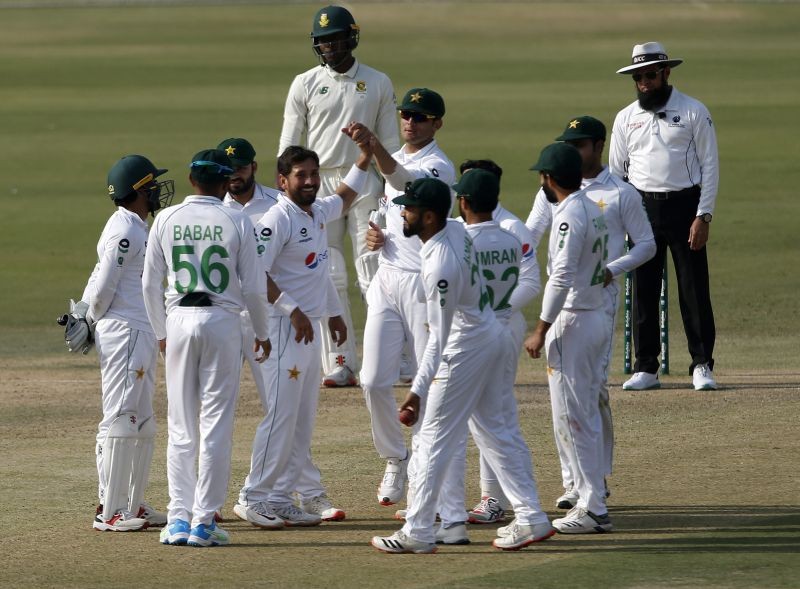Karachi: Pakistan's spinner Yasir Shah, center without cap, celebrates with teammates after taking the wicket of South Africa's batsman Anrich Nortje during the first day of the first cricket test match between Pakistan and South Africa at the National Stadium, in Karachi, Pakistan, Tuesday, Jan. 26, 2021. AP/PTI