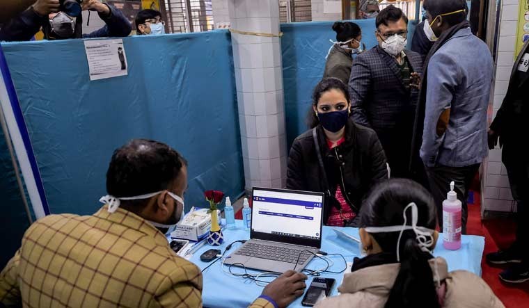 Health workers prepare for the dry run of the COVID-19 vaccine at a healthcare center in Daryaganj, New Delhi | PTI