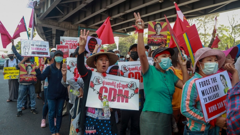 Anti-coup protesters flash the three-fingered salute in Yangon, Myanmar Wednesday, Feb. 24, 2021. (AP Photo)