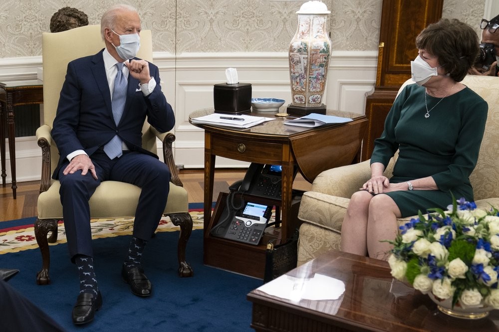 President Joe Biden meets with Sen. Susan Collins, R-Maine, to discuss a coronavirus relief package, in the Oval Office of the White House, Monday, Feb. 1, 2021, in Washington. (AP Photo/Evan Vucci)