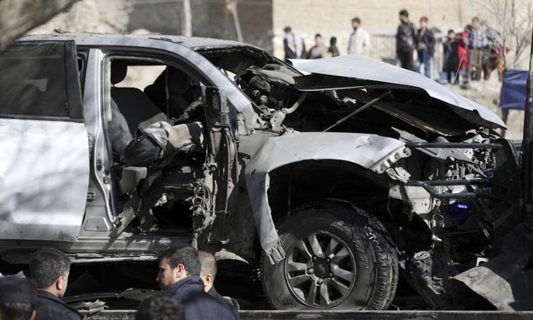 Afghan security officers inspect the site of a bomb attack in Kabul, Afghanistan. File/AP