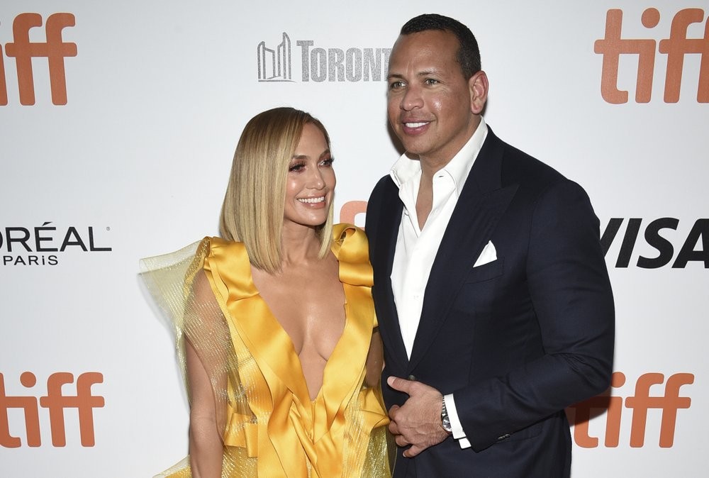 FILE - In this Saturday, Sept. 7, 2019, file photo, Jennifer Lopez, left, and Alex Rodriguez attend the premiere for "Hustlers" on day three of the Toronto International Film Festival at Roy Thomson Hall, in Toronto. Lopez and Rodriguez called off their two-year engagement, according to multiple reports based on anonymous sources. The former New York Yankees shortstop proposed to the actor a couple years ago after the celebrity couple started dating in early 2017. (Photo by Evan Agostini/Invision/AP, File)