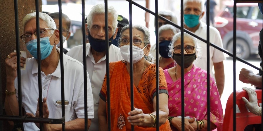 Senior citizens wait for their turn to get vaccinated with COVID-19 vaccine at BMC hospital in Mumbai. (File Photo | PTI)