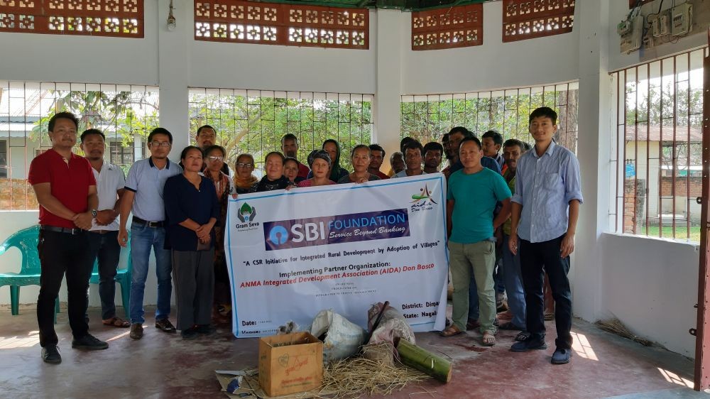Participants with resource persons and SBI-Gram Seva, AIDA Staff in Diezephe Village during an awareness programme on Integrated Nutrient Management and Bio-control of Pest and Diseases held on March 15.