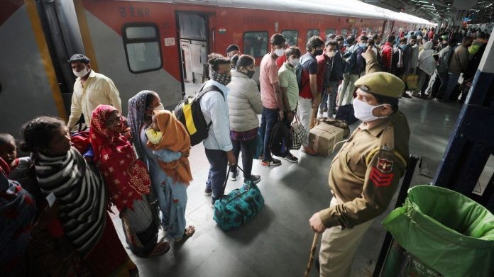 Passengers wait for Covid-19 tests at Jammu Railway Station, on 24 March 2021 | PTI