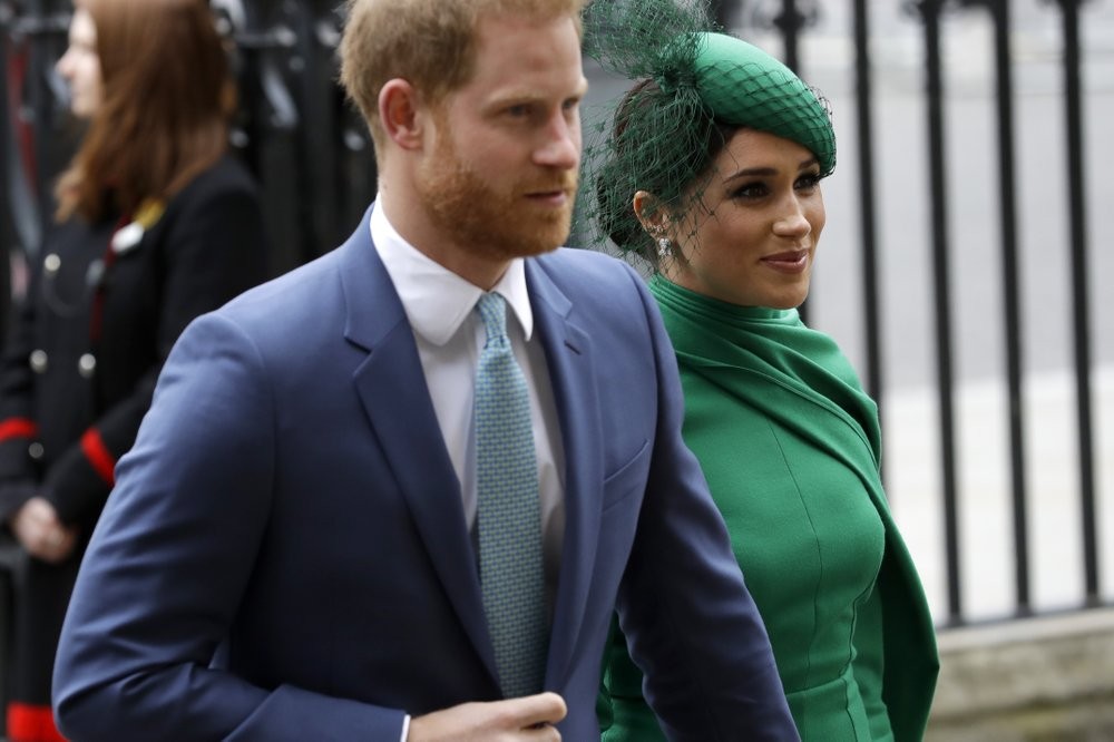FILE - In this March 9, 2020, file photo, Britain's Harry and Meghan the Duke and Duchess of Sussex arrive to attend the annual Commonwealth Day service at Westminster Abbey in London. Almost as soon as Meghan and Prince Harry's interview with Oprah Winfrey aired, many were quick to deny Meghan’s allegations of racism on social media. Many say it was painful to watch Meghan’s experiences with racism invalidated by the royal family, members of the media and the public, offering up yet another example of a Black woman’s experience being disregarded and denied. (AP Photo/Kirsty Wigglesworth, File)